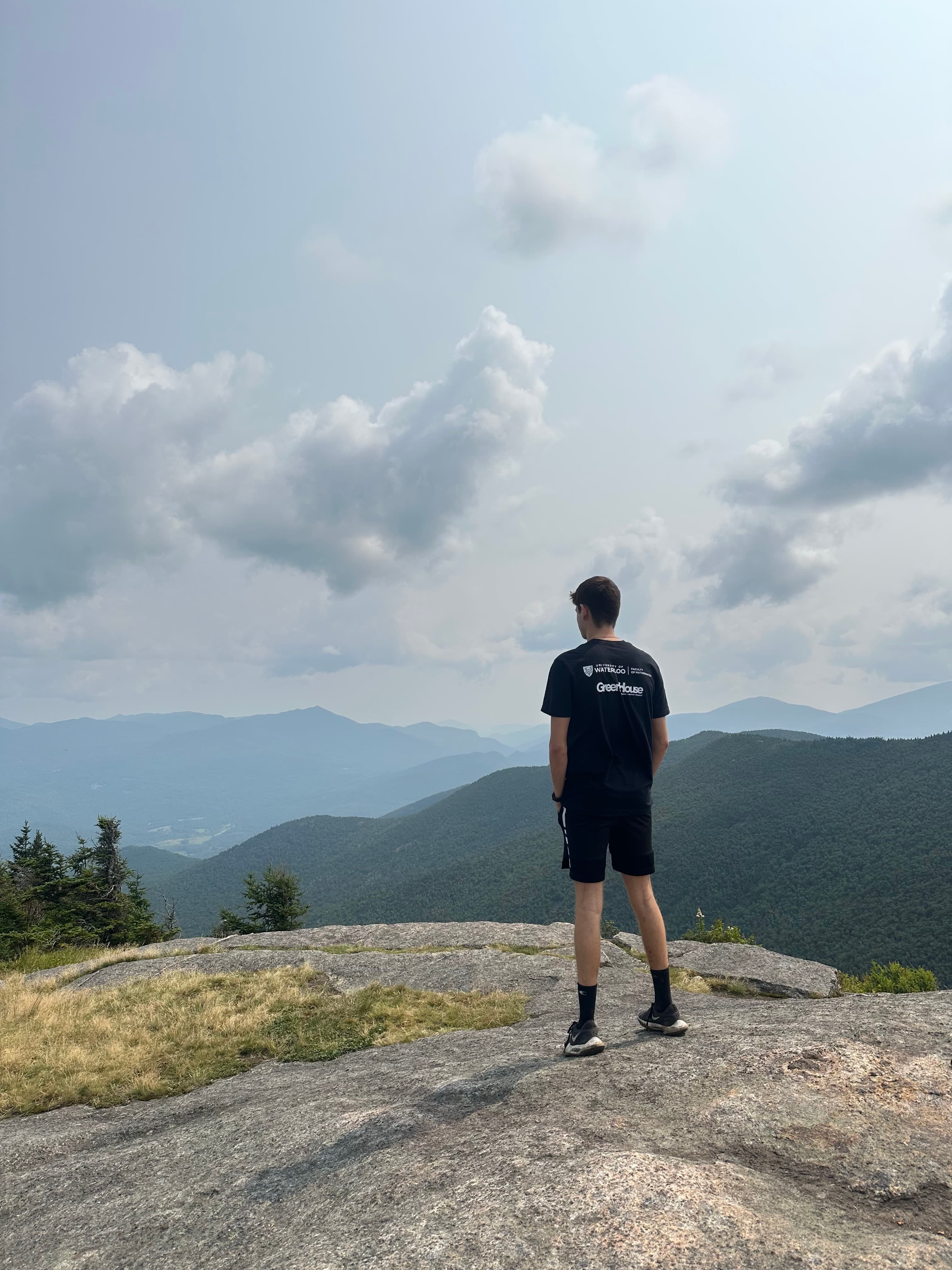 Om looking over a mountain landscape